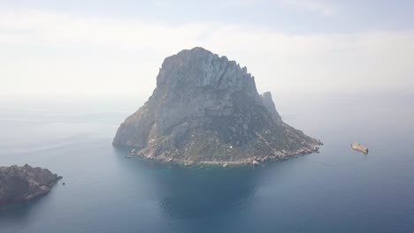 aerial shot of scenic rocky mountain es vedra island in the blue sea in ibiza