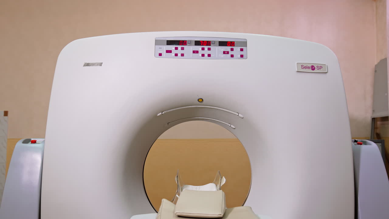 Computerized axial tomography scan. Magnetic resonance imaging machine in the hospital room with no people.