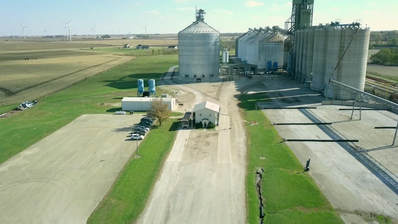 Grain Elevator Fall afternoon with semi trucks coming and going
