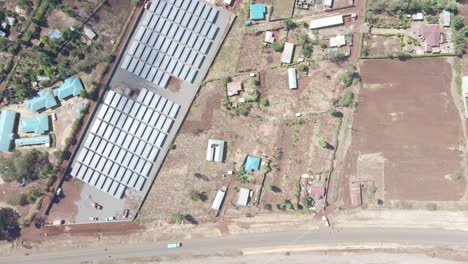 aerial top down view of a rural road beside the market of loitokitok kenya