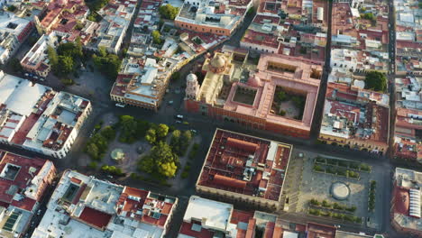 drone shot over the center of querétaro, overlooking the cathedral and the central garden