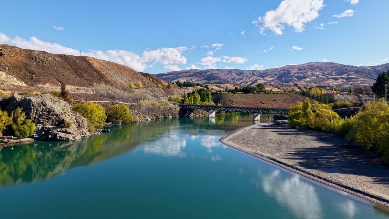 Bridge over Kawarau River, scenic fall view, calm and serene landscape
