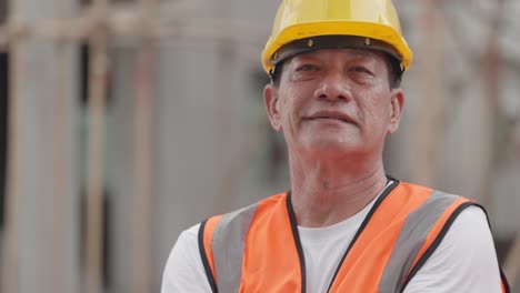 portrait of asian foreman or engineer have skill and expertise, wearing construction vest and hardhat crossed arm and looking at camera. employee working in construction industry, real estate business
