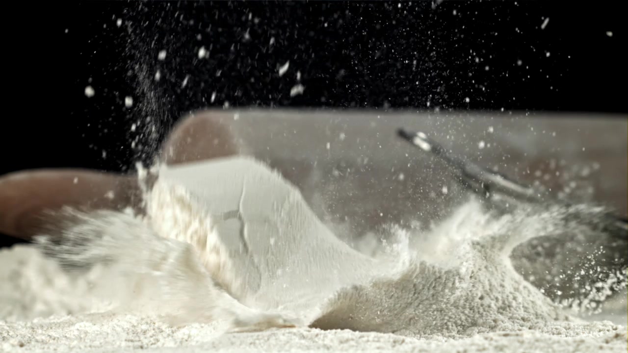 Close Up of Flour Falling and Splashing in Slow Motion