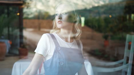 woman enjoying a view from a window