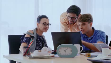 Group-meeting-of-creative-business-people,-designer-and-artist-at-office-desk.