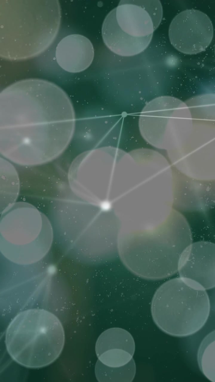 Vertical video: Soft flare sparking network forming, glowing bokeh discs drifting, calming for loop