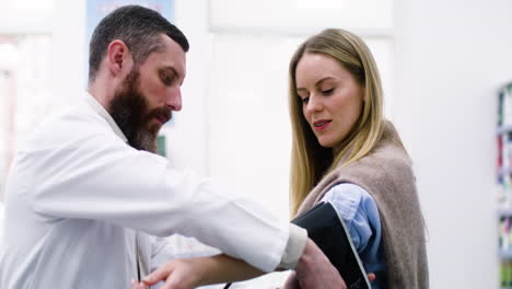 Pharmacist-checking-blood-pressure