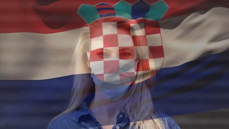 animation of flag of croatia over woman wearing face mask