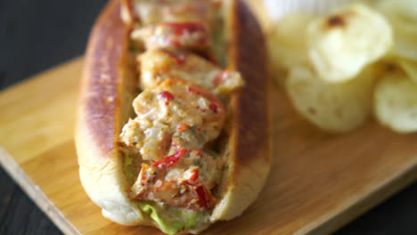 homemade lobster roll  with potato chips and ketchup