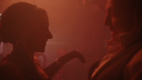 couple dancing in a smoky room