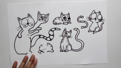 drawing cartoon cats with a marker