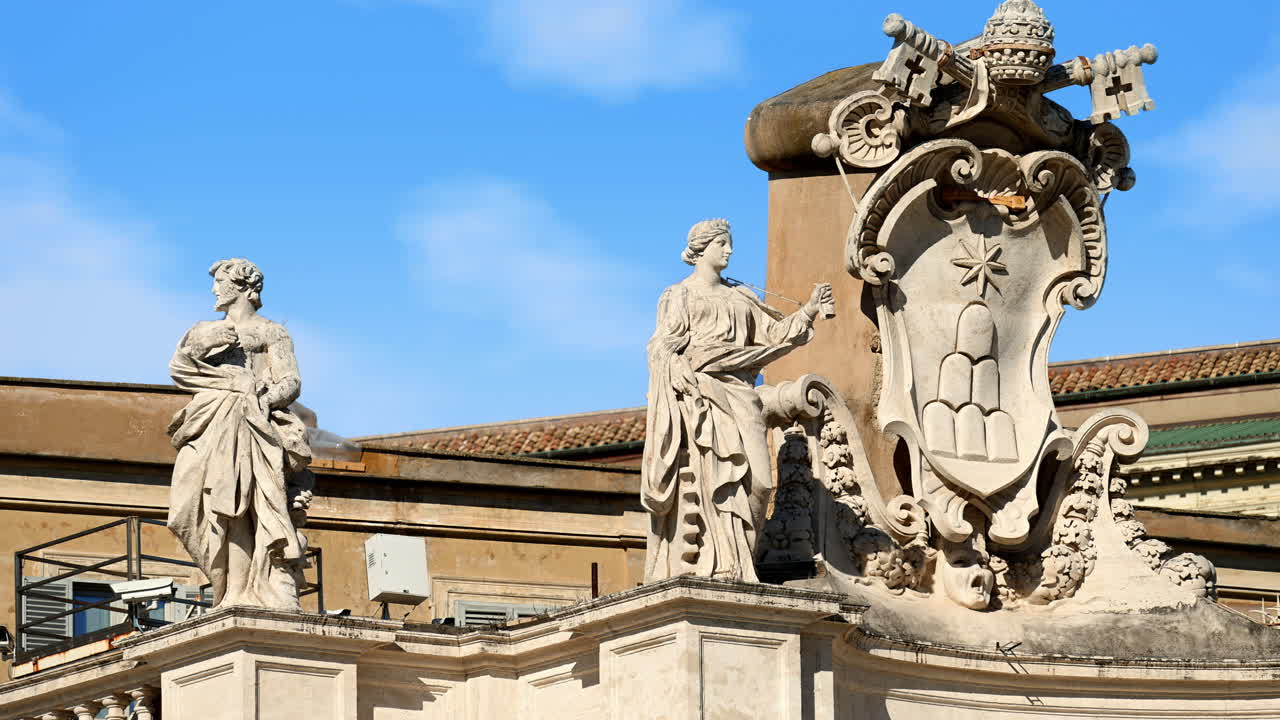 Statue on the Facade of St. Peter's Basilica on the blue sky background, in St. Peter's Square, Vatican City, Rome, Italy