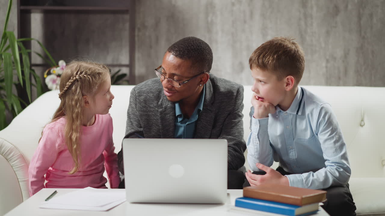 English native speaker tutor gives task to boy and girl