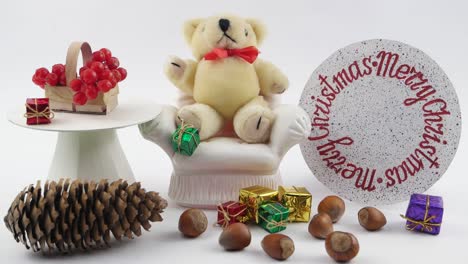 teddy bear and  christmas decorations, white background,
children's decorative composition