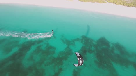 MAN-ENJOY-power-of-the-kite-drag-HIM-at-high-speed-ON-CARIBBEAN-SEA,-LOS-ROQUES