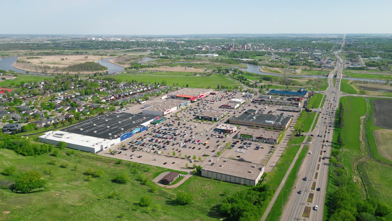 Drone zooms in over Brandon’s Corral Centre with cars bustling beneath