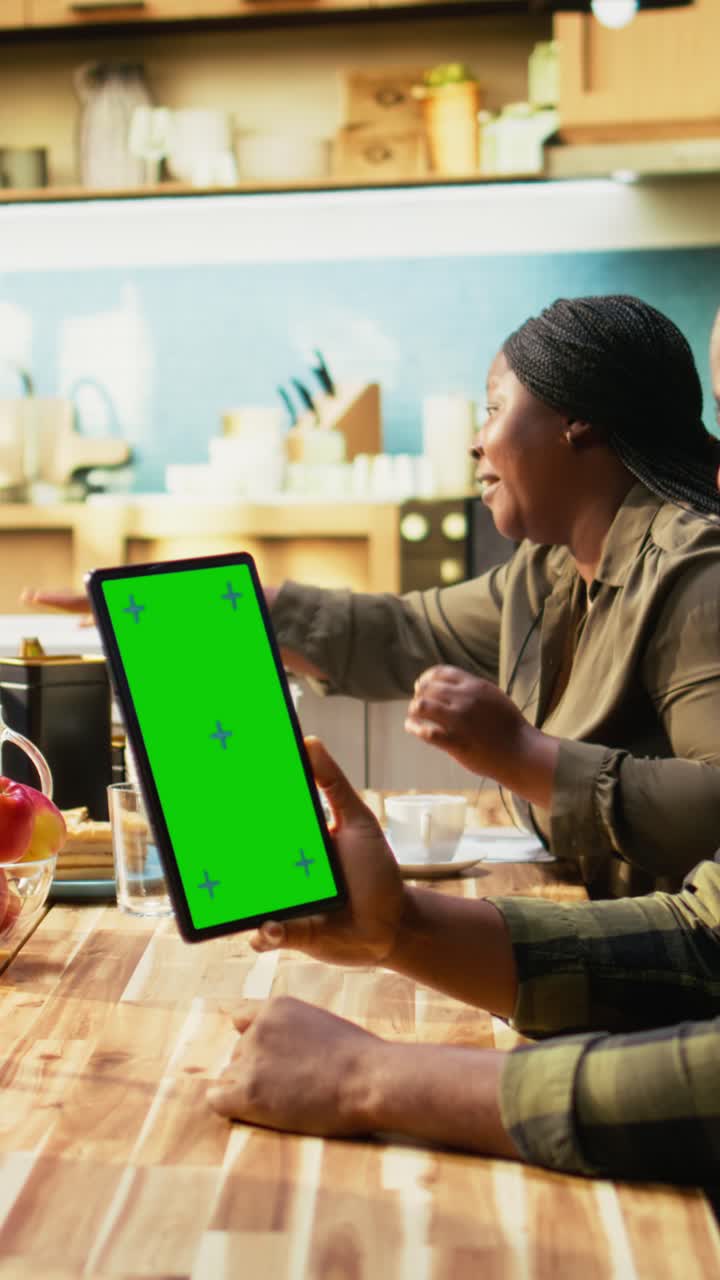 Vertical Video Vertical green screen next to black family enjoying relaxing weekend breakfast