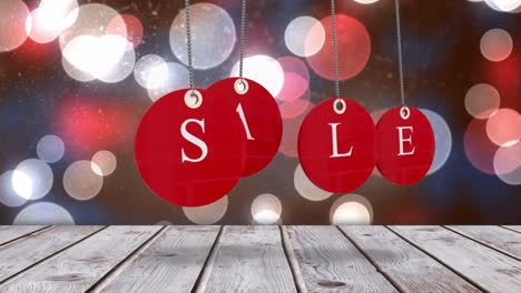 Red-sale-tags-hanging-against-glowing-background