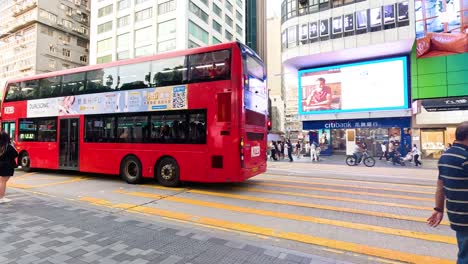 double-decker buses and pedestrians on city street