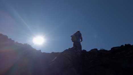 hiker approached turning head on top of mountain low angle approached close up kananaskis alberta canada