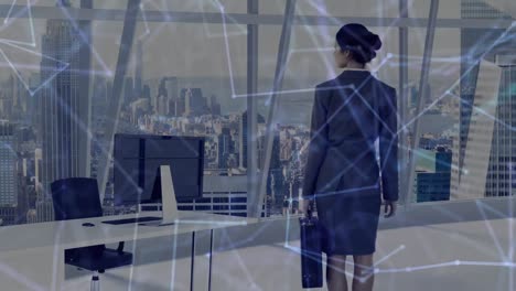 Animation-of-network-of-connections-over-businesswoman-in-modern-office-in-background