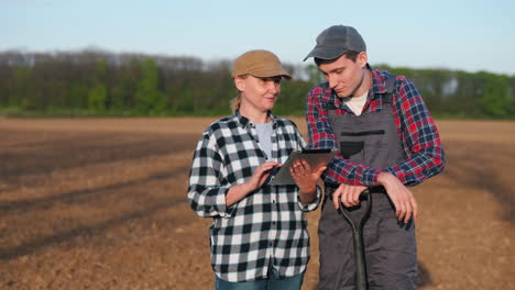 farmers using digital technology in a field