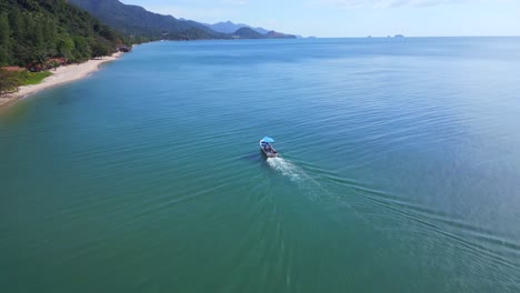 amazing aerial top view flight pursuit flight drone
motor boat white sandy jungle beach, island koh chang thailand 2022