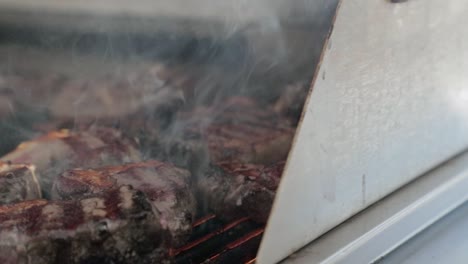 lamb chops cooking on barbecure. slow motion