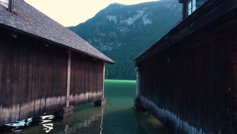 wooden buildings built on the shore of the king's lake, königssee in germany, bavaria