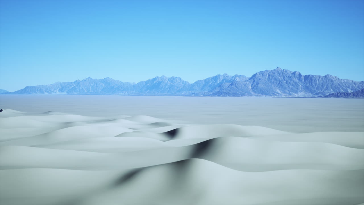 Stunning Desert Landscape with Rolling Sand Dunes and Distant Mountains