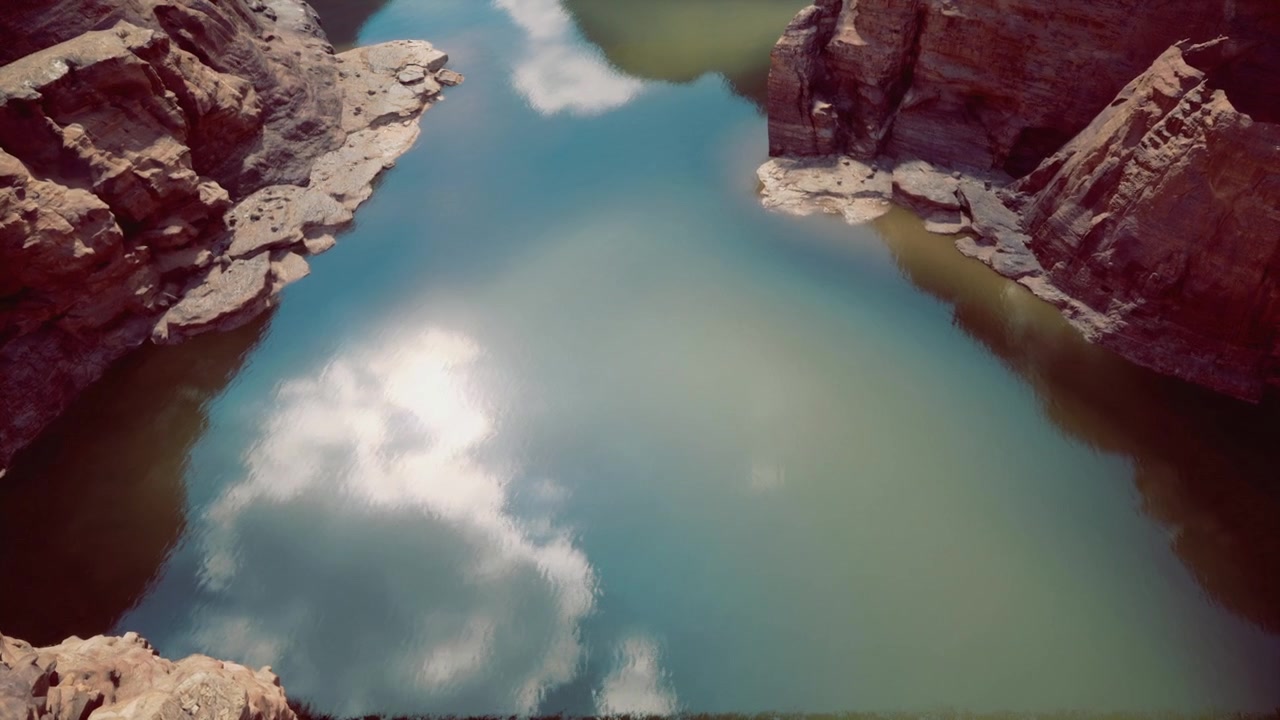 Escena tranquila de cañón con acantilados vibrantes y una superficie de agua espejada.