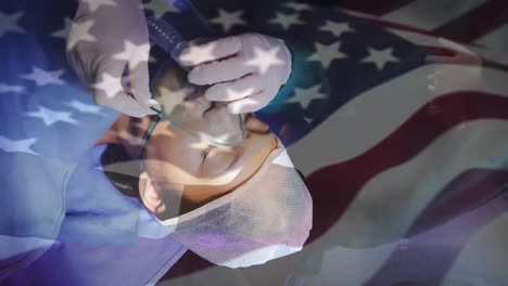 animation of flag of usa waving over surgeons in operating theatre