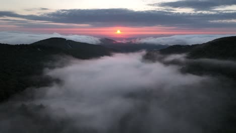 Fog-and-Clouds-at-sunrise-in-the-Appalachian-Mountains-over-Sampson-NC-near-Boone-and-Blowing-Rock-NC,-North-Carolina