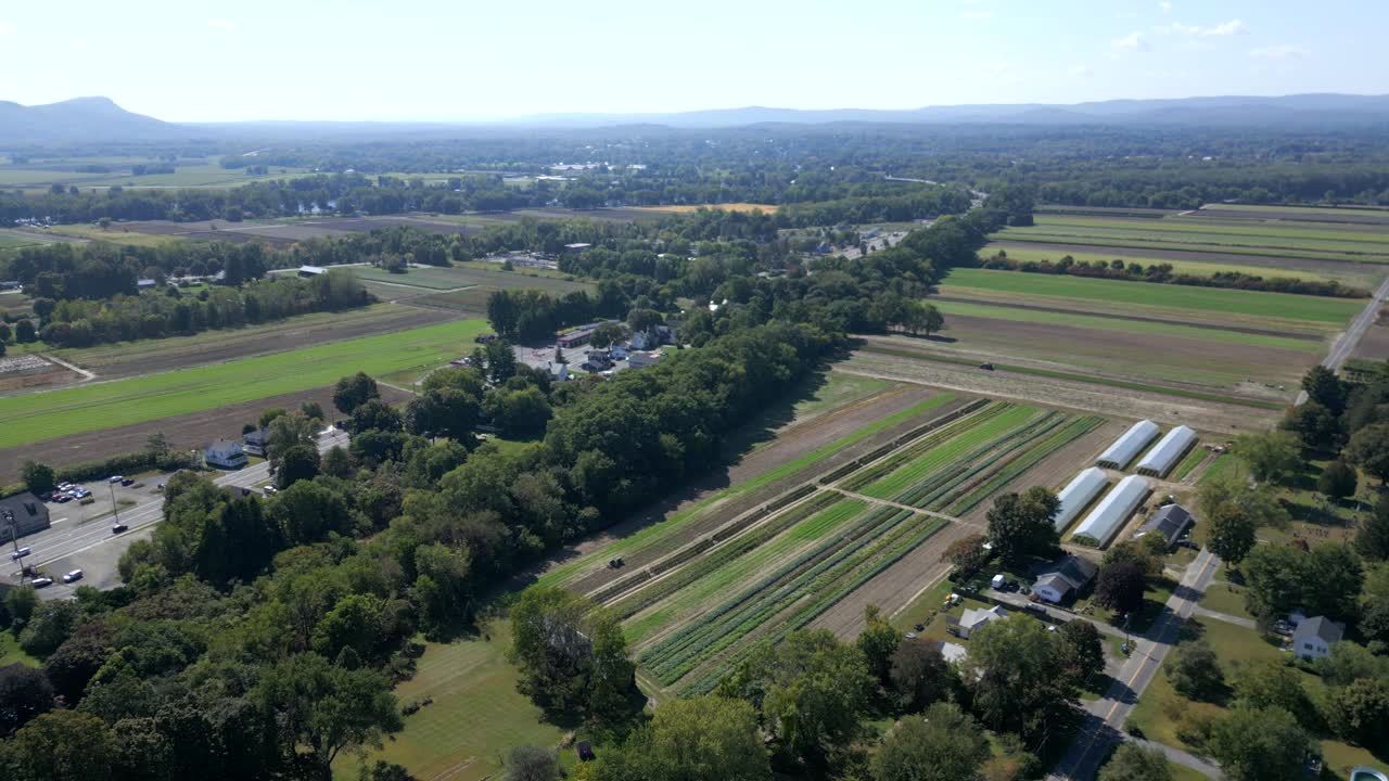 Aerial view of riverside farmlands and countryside houses from above Route 9, Hadley, Massachusetts, USA