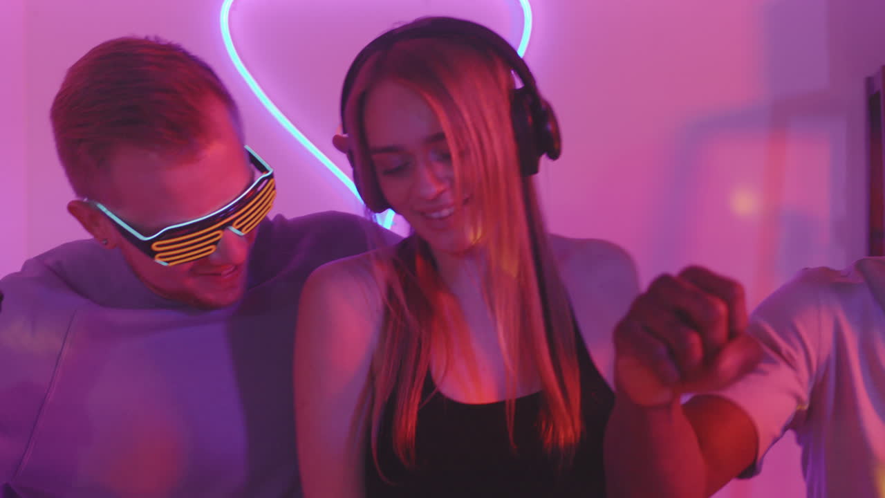 Men Dancing with Female DJ