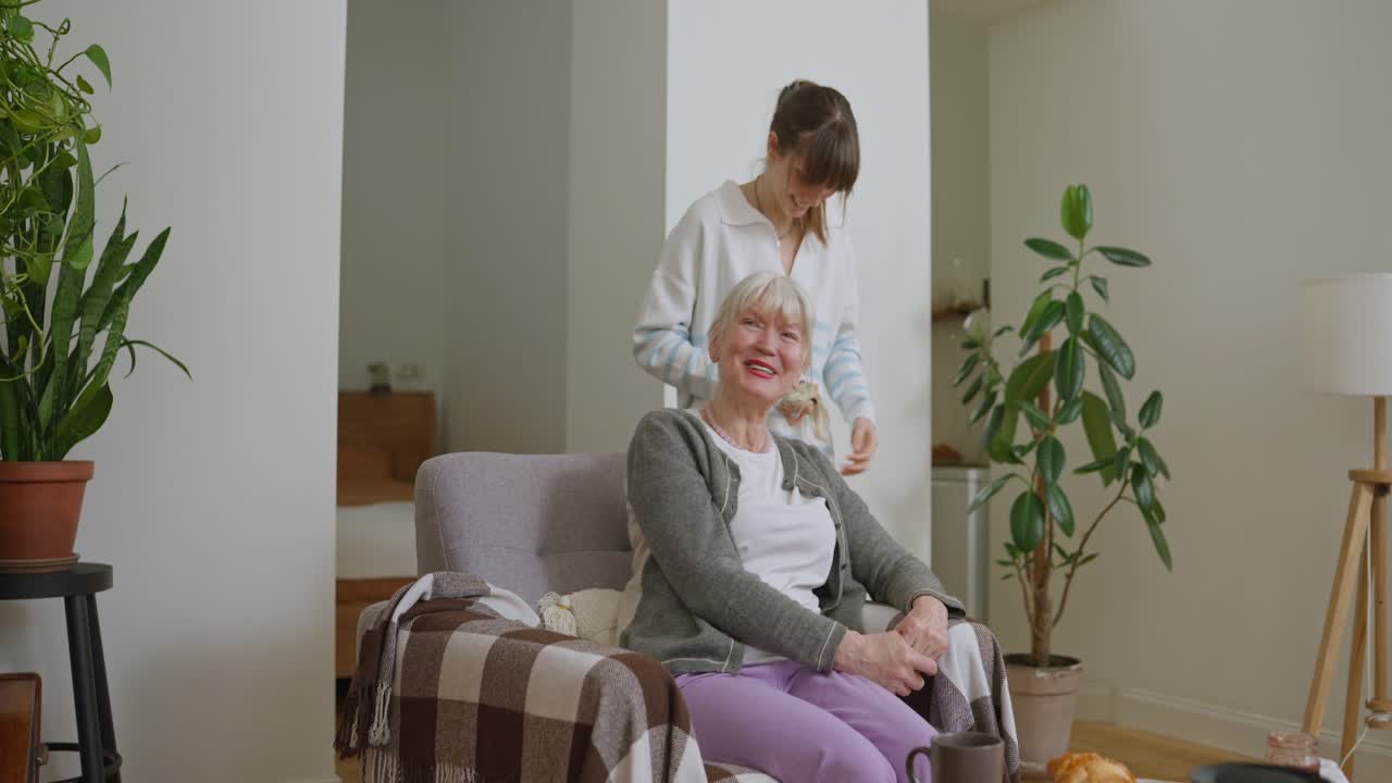 Young Woman Assisting Senior Woman at Home