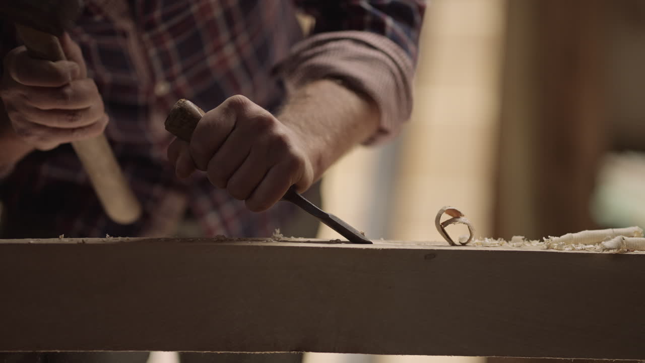 Woodworking with chisel and hammer