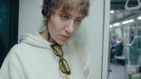 female artist drawing sketch in underground train