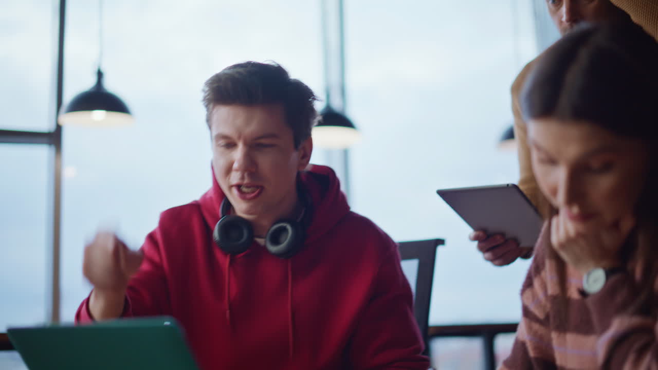 People watching a computer screen