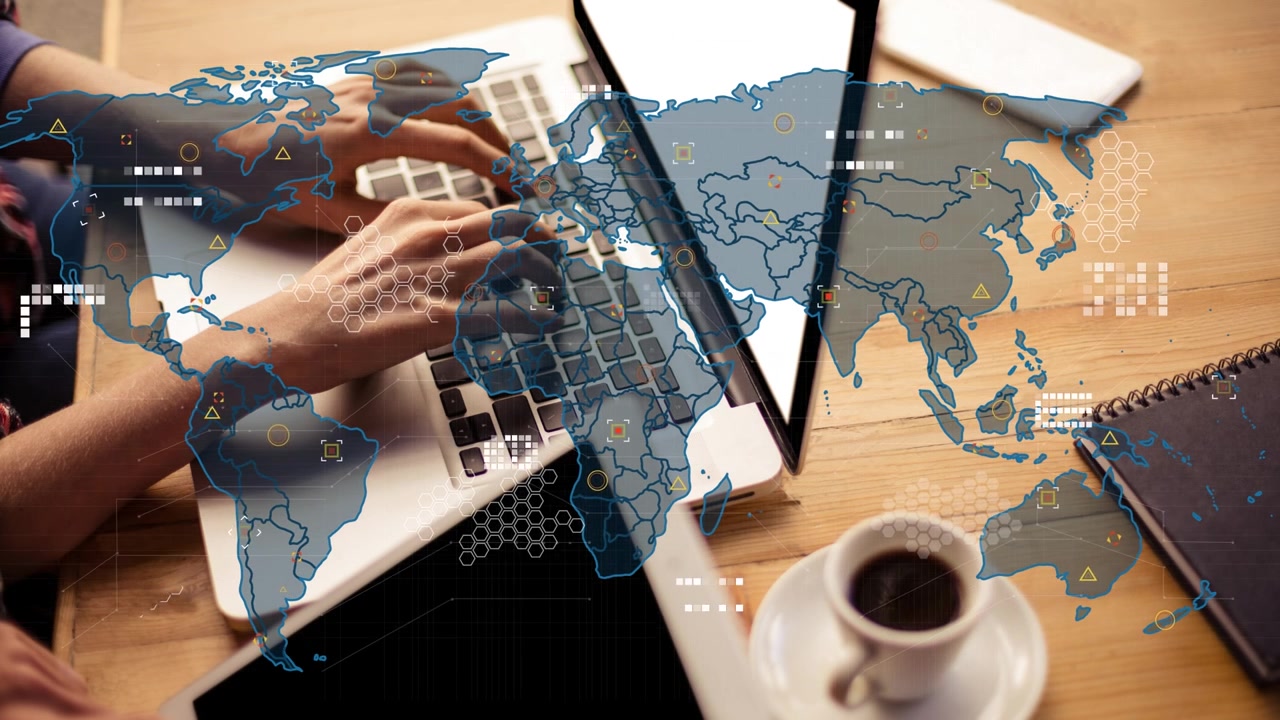 Animation of world map over person using laptop