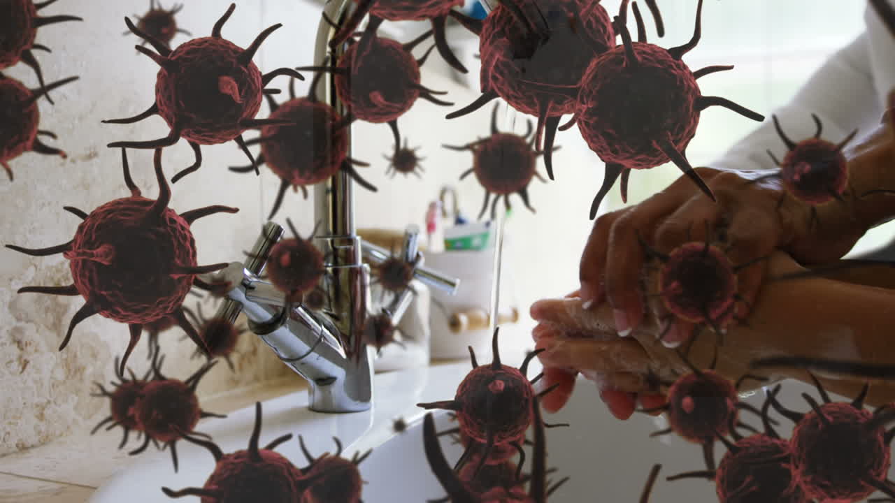 animación de células de macro coronavirus que se extienden por las manos de un padre e hijo lavándose las manos