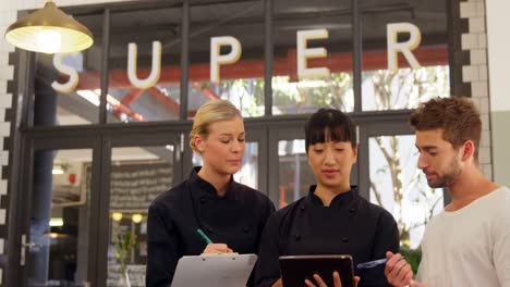 waiter and waitress writing order in notepad 4k