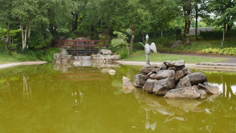 Model-and-dog-cross-bridge,-immersed-in-tranquility