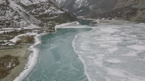 Aerial-View-Of-Frozen-Turquoise-Gilgit-River