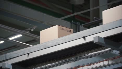 boxes on a conveyor belt in a factory