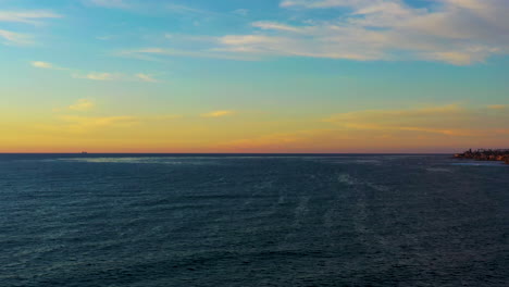 Breathtaking-4k-aerial-flight-over-ocean-just-before-sunset