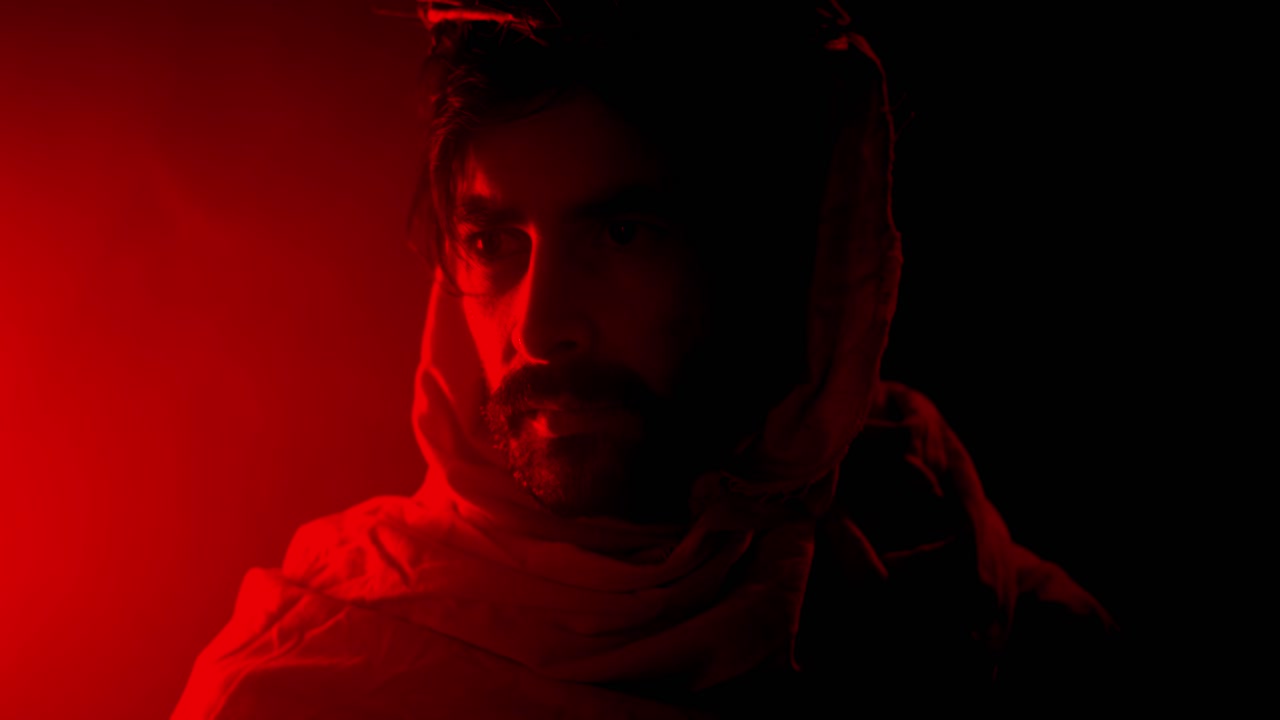 Dramatic, stylistic visual of Jesus Christ Wearing Crown of Thorns in Red Light for Christianity, Easter visual or bible scene.