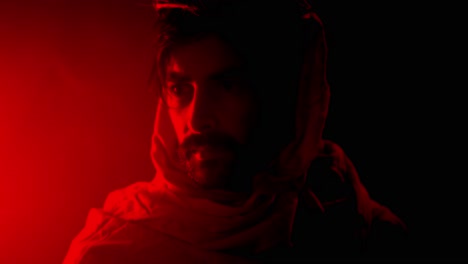 dramatic, stylistic visual of jesus christ wearing crown of thorns in red light for christianity, easter visual or bible scene.