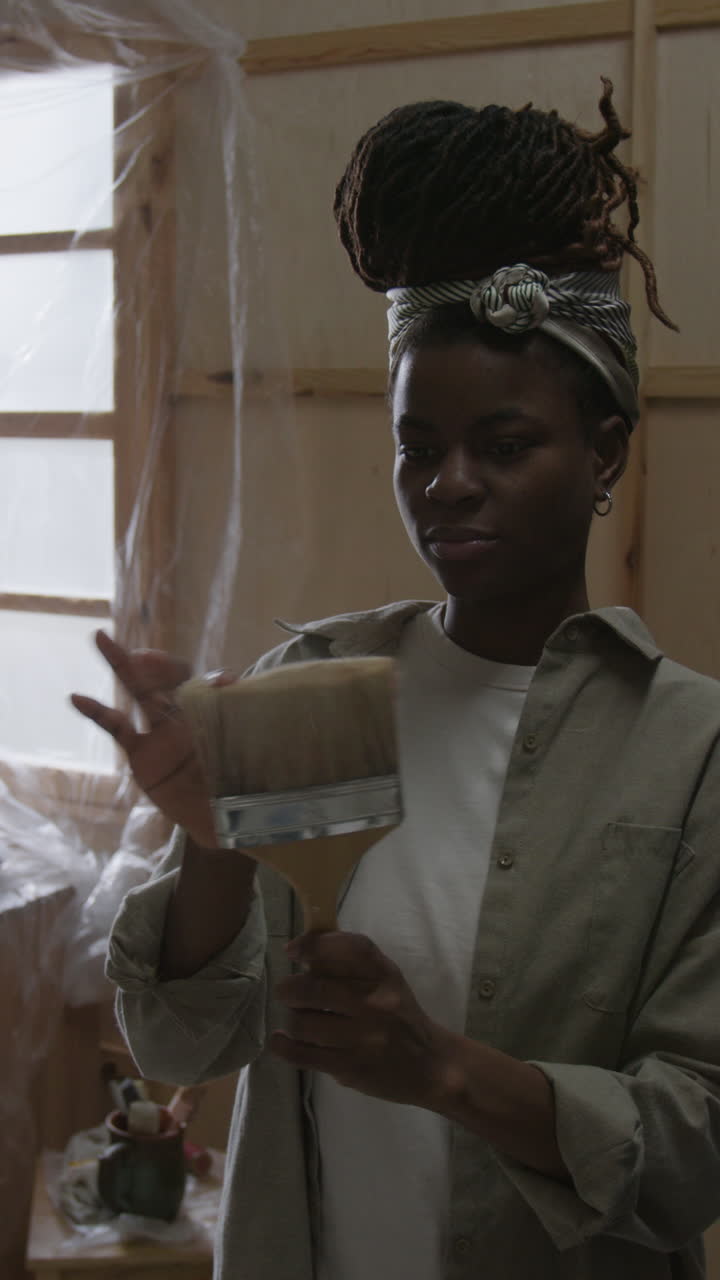 Woman Holding a Paint Brush